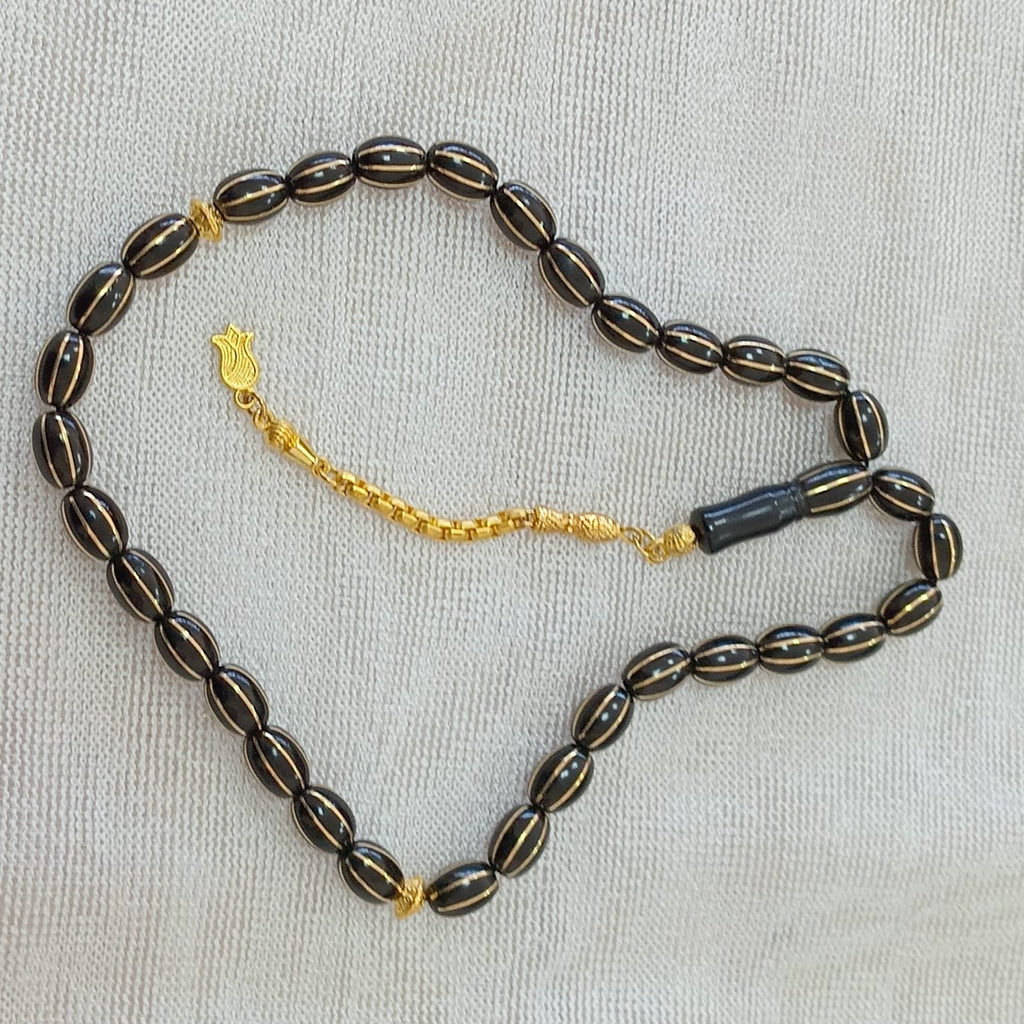 Oval-Cut Press Oltu Stone Tasbih with Brass Melon-Slice Inlay, 7.5x10.5mm