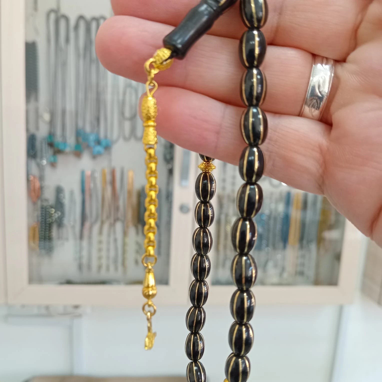 Oval-Cut Press Oltu Stone Tasbih with Brass Melon-Slice Inlay, 7.5x10.5mm