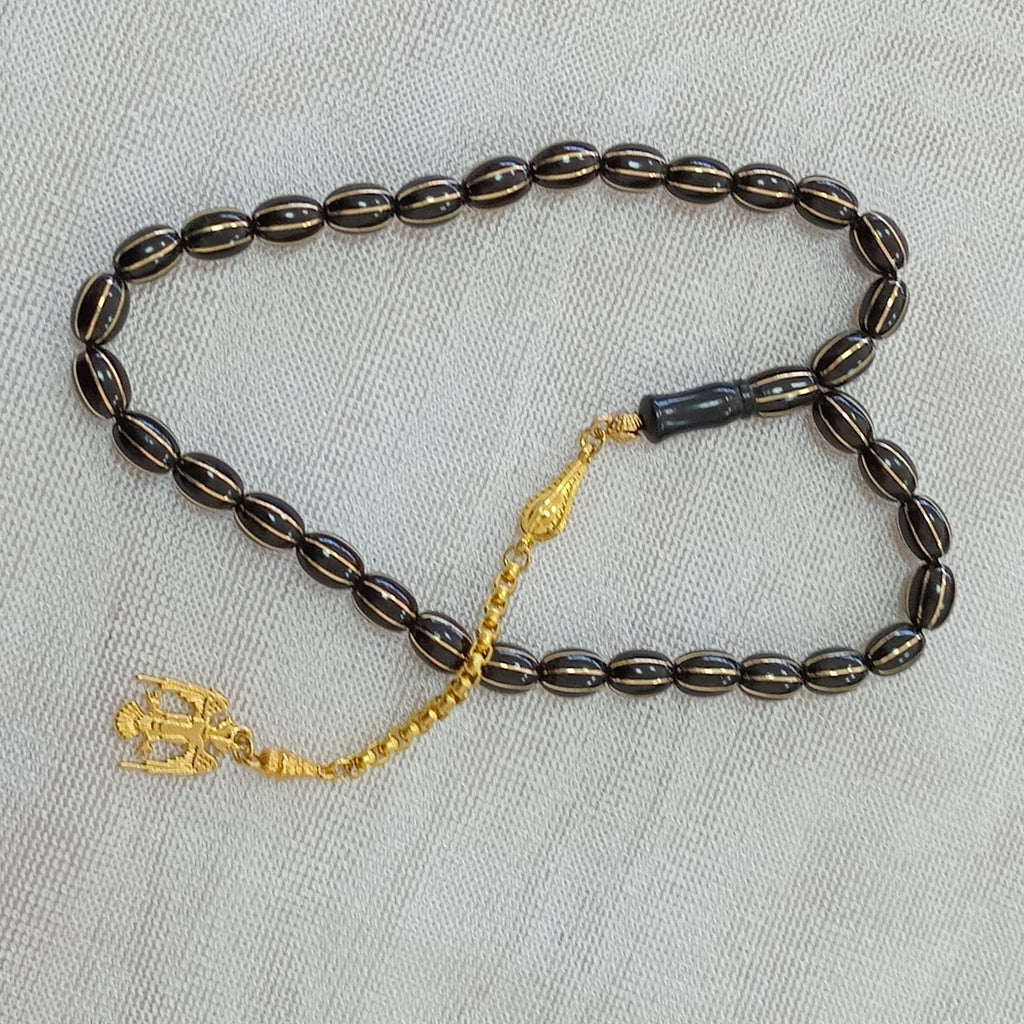 Oval-Cut Press Oltu Stone Tasbih with Brass Melon-Slice Inlay, 7.5x10.5mm