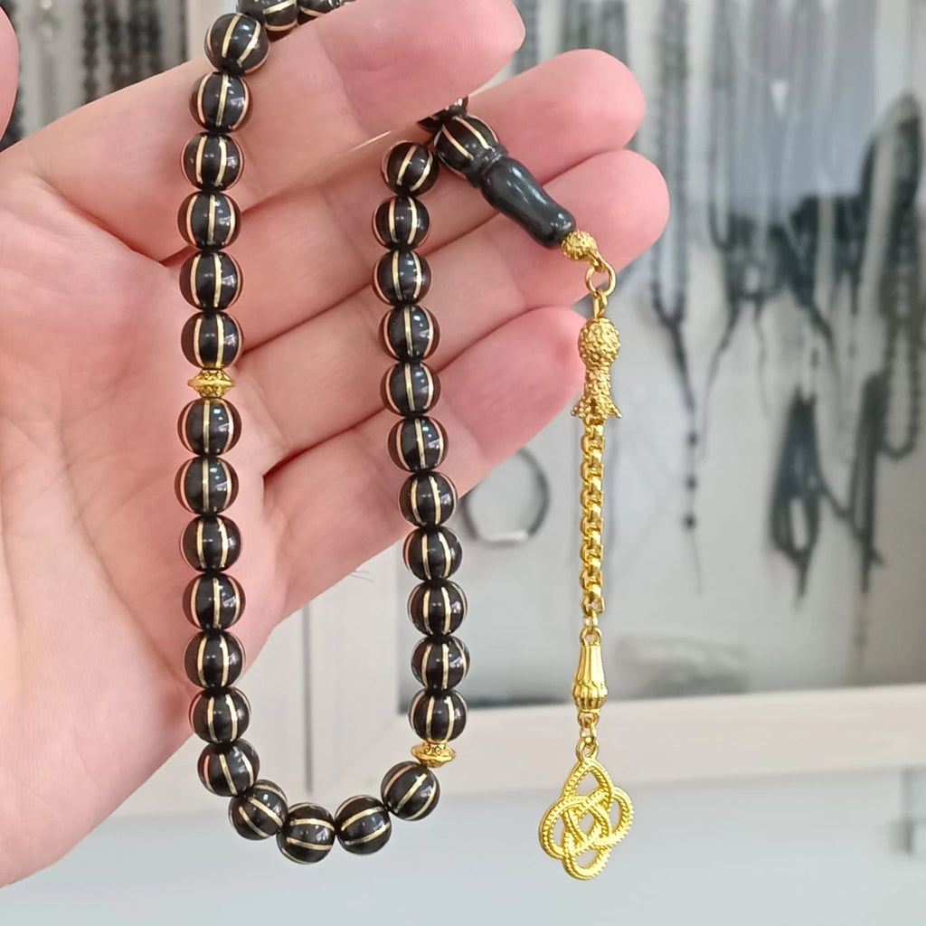 Oval-Cut Press Oltu Stone Tasbih with Brass Melon-Slice Inlay, 7.5x10.5mm