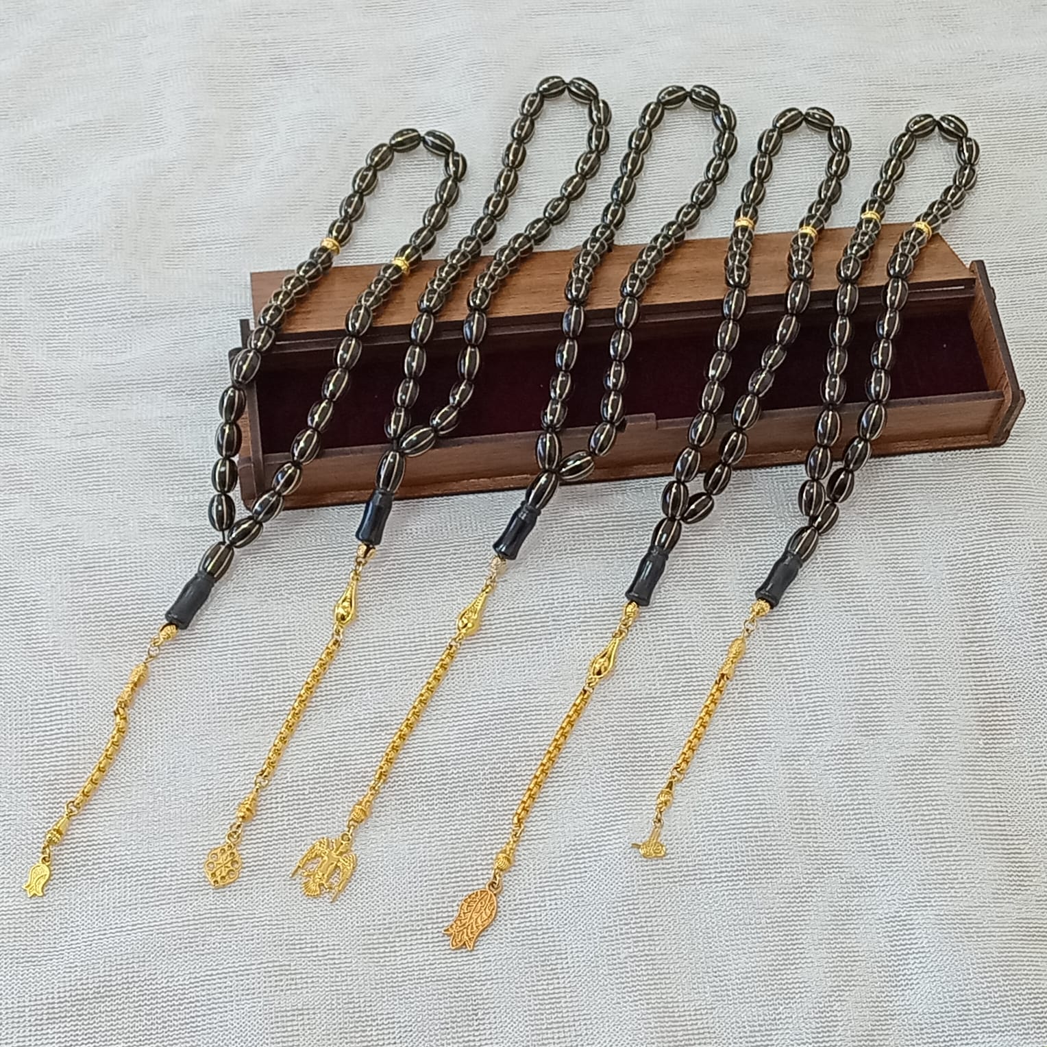 Oval-Cut Press Oltu Stone Tasbih with Brass Melon-Slice Inlay, 7.5x10.5mm